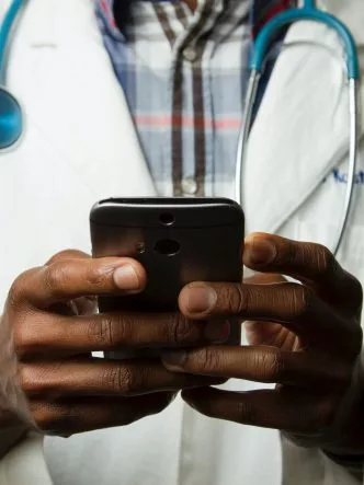 Healthcare Professional holding a mobile phone